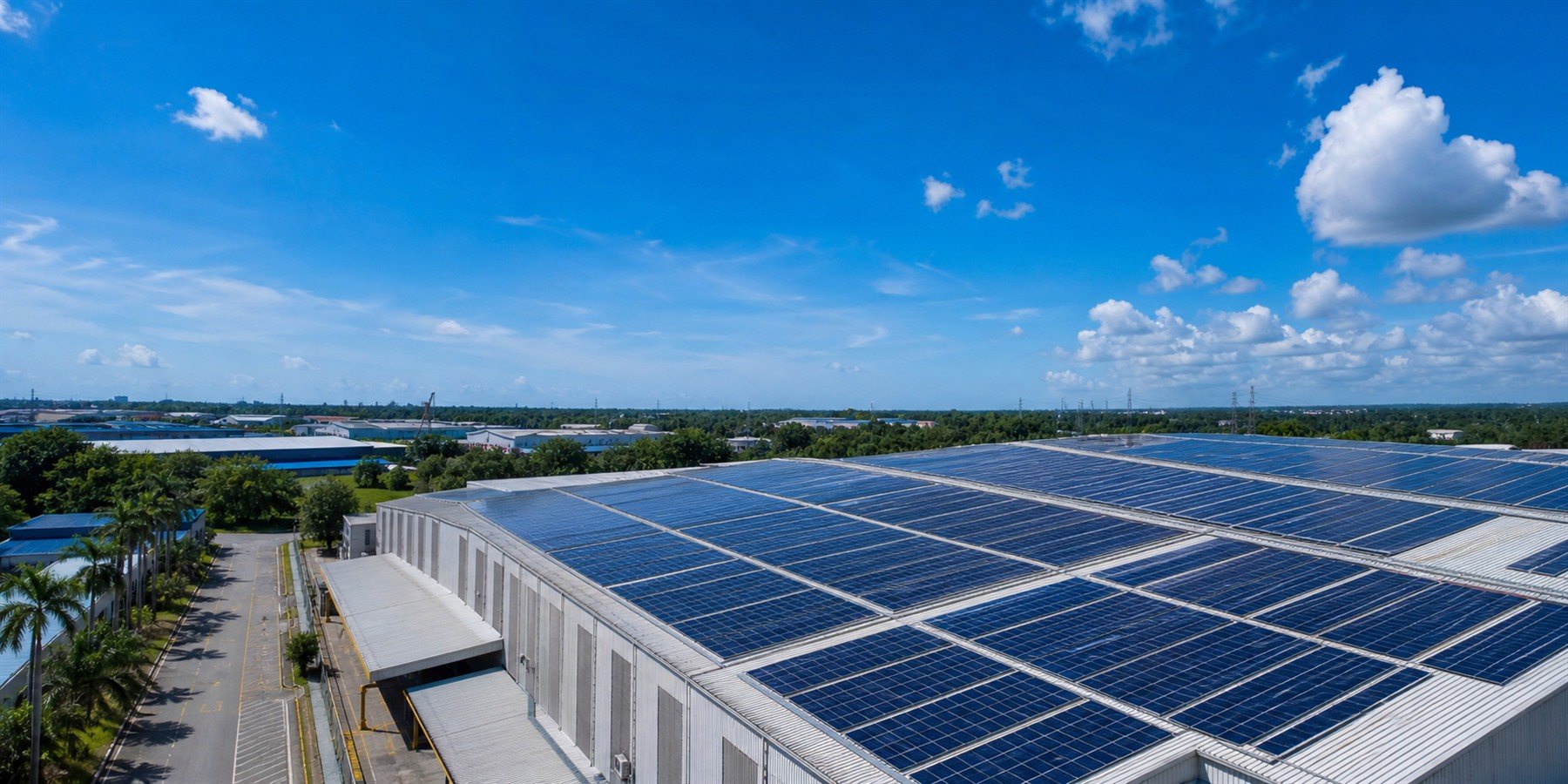 Aerial view of a Malaysian factory rooftop covered in solar panels